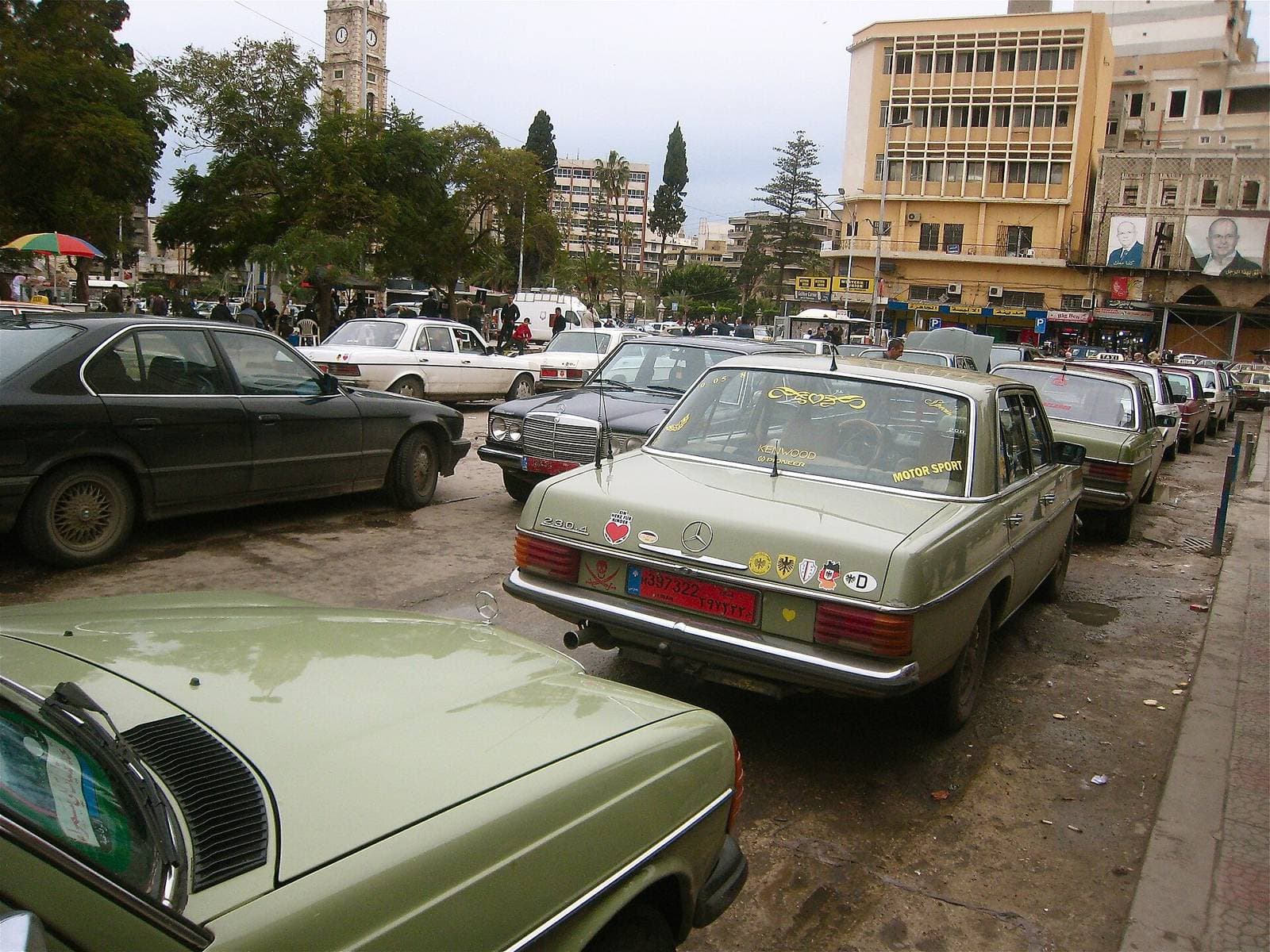 Row of Mercedes service taxis waiting at the Tal square taxi rank in Tripoli, Lebanon